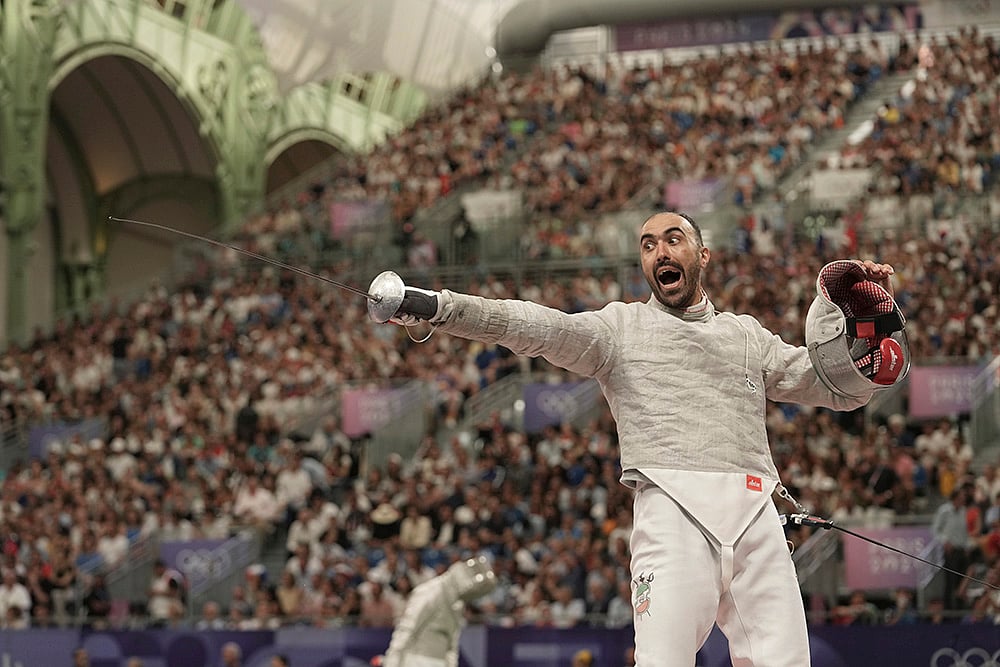 | Photo: AP/Thibault Camus : Iran's Ali Pakdaman reacts in the men's team Sabre quarterfinal